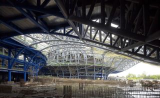 Within the roof's 'legs' are different performance theatres, including an opera house and concert hall