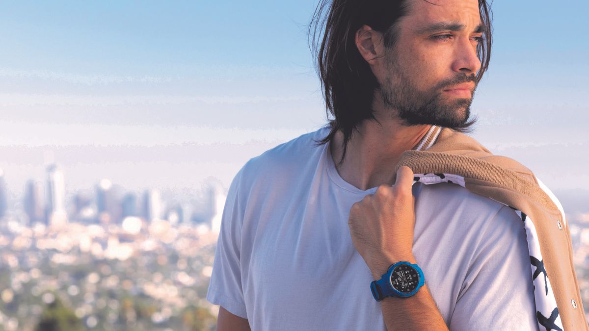 Man wearing Garmin Instinct Crossover watch