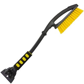 A long black handled, double ended ice scraper with a yellow bristled brush on one side and a black plastic scraping tool on the other