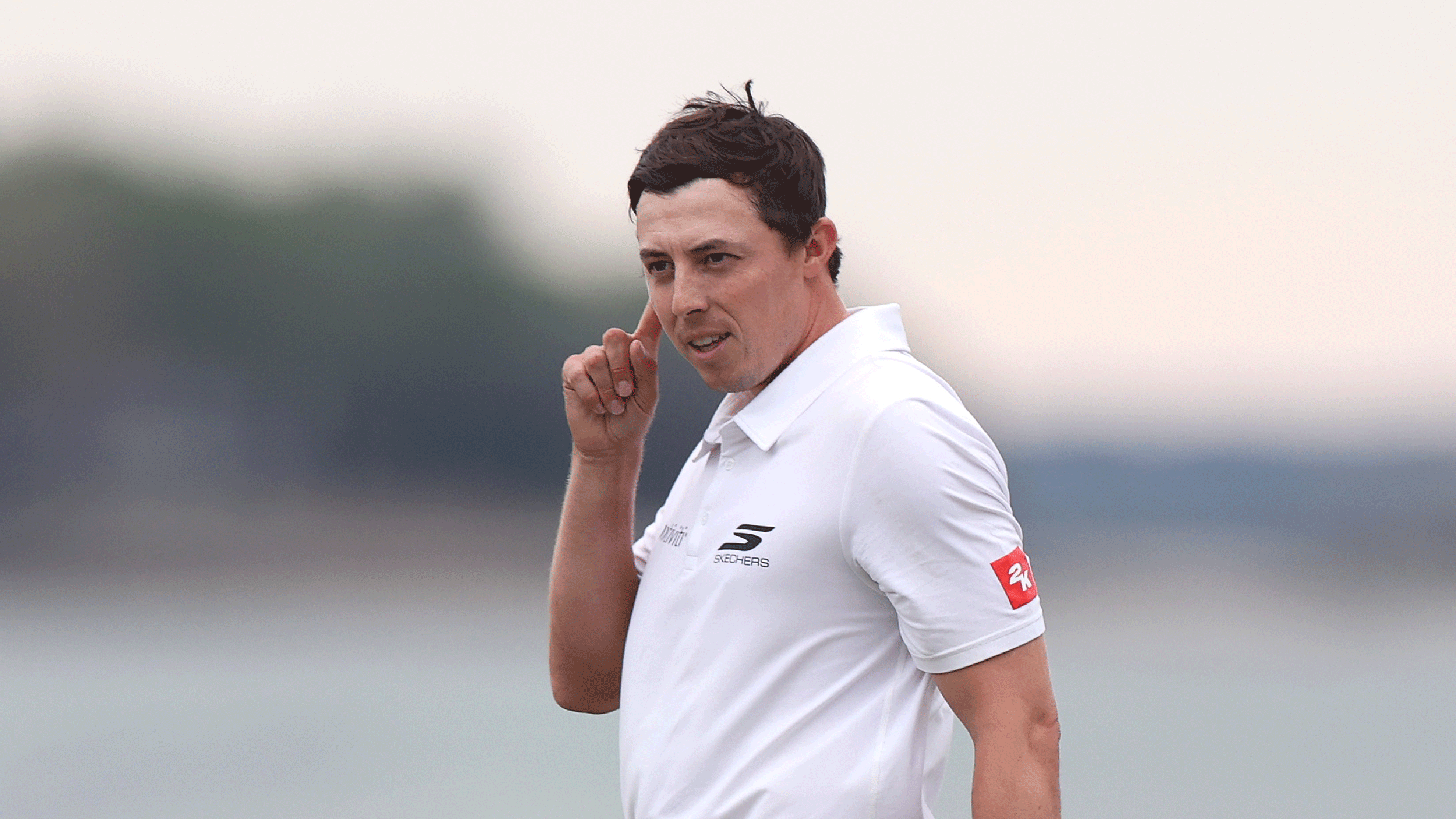 Matt Fitzpatrick touches his ear after holing the winning putt at the 2026 RBC Heritage