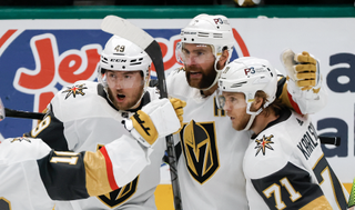 Alex Pietrangelo #7 of the Vegas Golden Knights is congratulated by his teammates after scoring a goal against the Dallas Stars during the second period in Game Three of the Western Conference Final of the 2023 Stanley Cup Playoffs