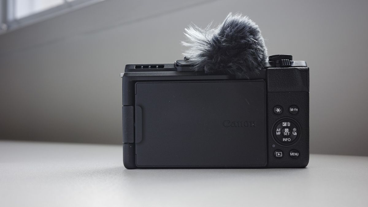 Rear of the Canon PowerShot V1 compact vlogging camera on a white desk