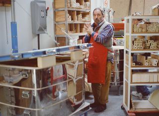 A portrait of Peter Shire photographed in his studio.