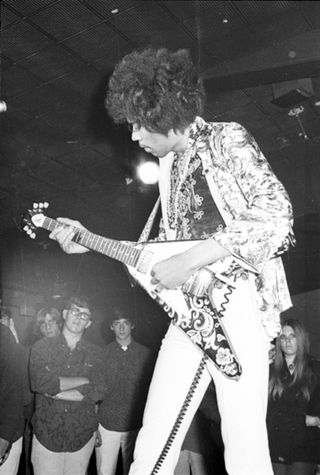 Jimi Hendrix of the rock band "The Jimi Hendrix Experience" performs onstage with a Gibson Flying V electric guitar at the Fifth Dimension Club on August 15, 1967 in Ann Arbor, Michigan.
