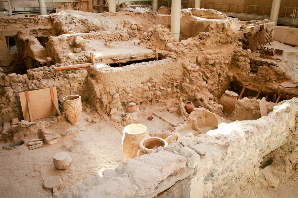 Akrotiri is an archaeological site from the Minoan Bronze Age on the Greek island of Santorini (Thera). Photo of recovered aincient buildings and decorated pottery.