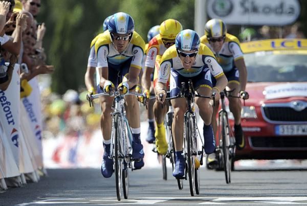 Team Astana crosses the line.