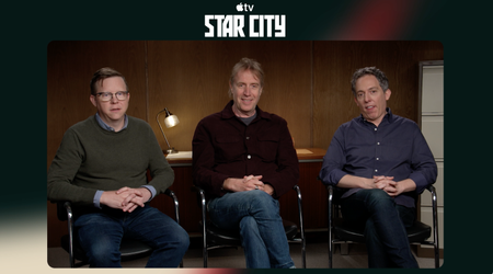three men in a press room