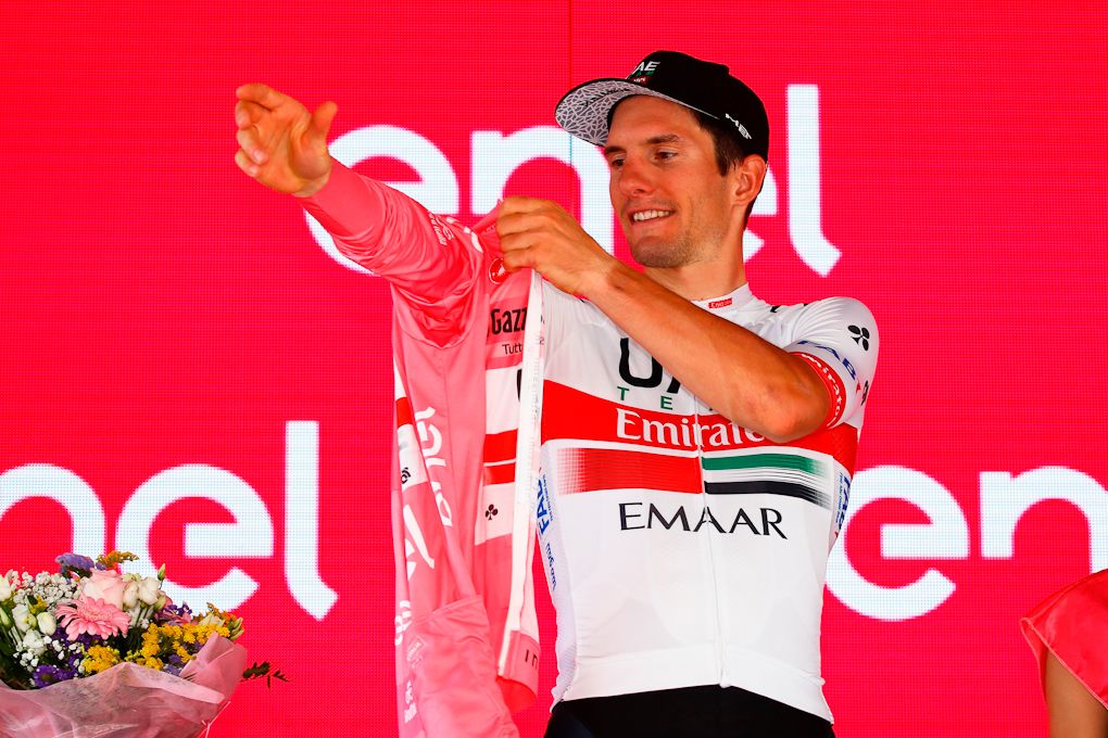 Jan Polanc putting on the pink jersey after stage 12 at the Giro
