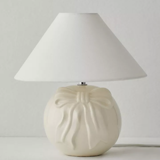 white ceramic table lamp with bow