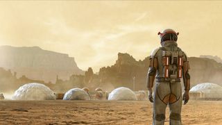 A concept image of an astronaut in front of a settlement on Mars.