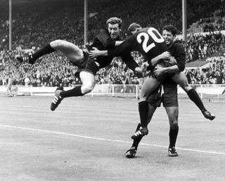 Mexico's Enrique Borja is embraced by team-mates after scoring against France at the 1966 World Cup.