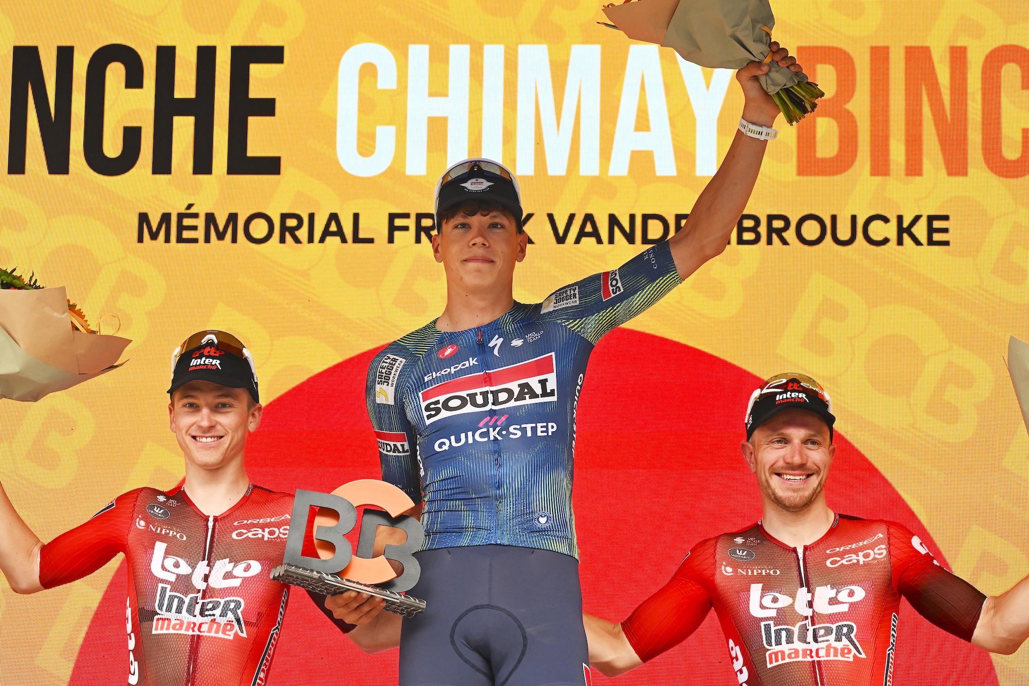 Final podium (L-R): Jenno Berckmoes of Lotto Intermarche on second place, race winner Paul Magnier of Soudal Quick-Step and Lionel Taminiaux of Lotto Intermarche on third place