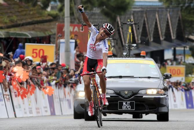 Meiyin Wang (Hengxiang Cycling Team) celebrates his victory at the finish in Cameron Highlands
