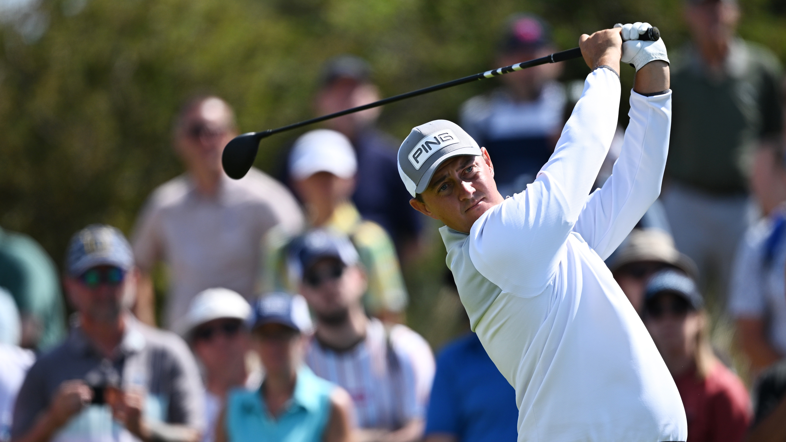 Joe Dean holds his finish on a fairway wood shot 