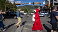 Abortion rights protester crosses the street in Jackson Hole, Wyoming