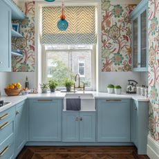 blue kitchen with patterned wallpaper