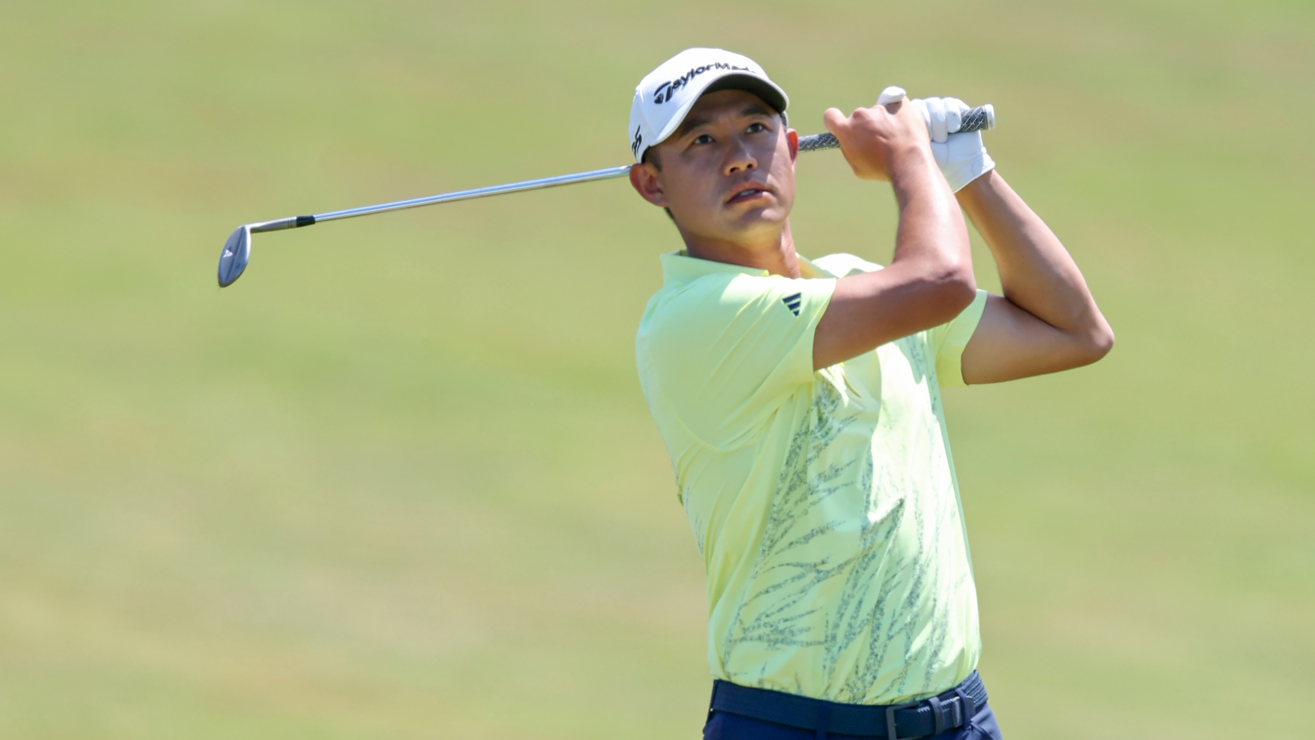 Collin Morikawa holds his finish on an iron shot
