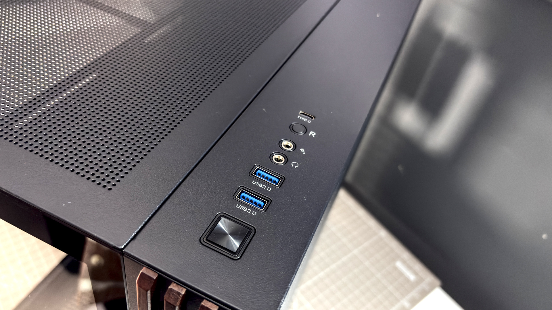 The Thermaltake View 380 WS ARGB on a desk with various components fitted.