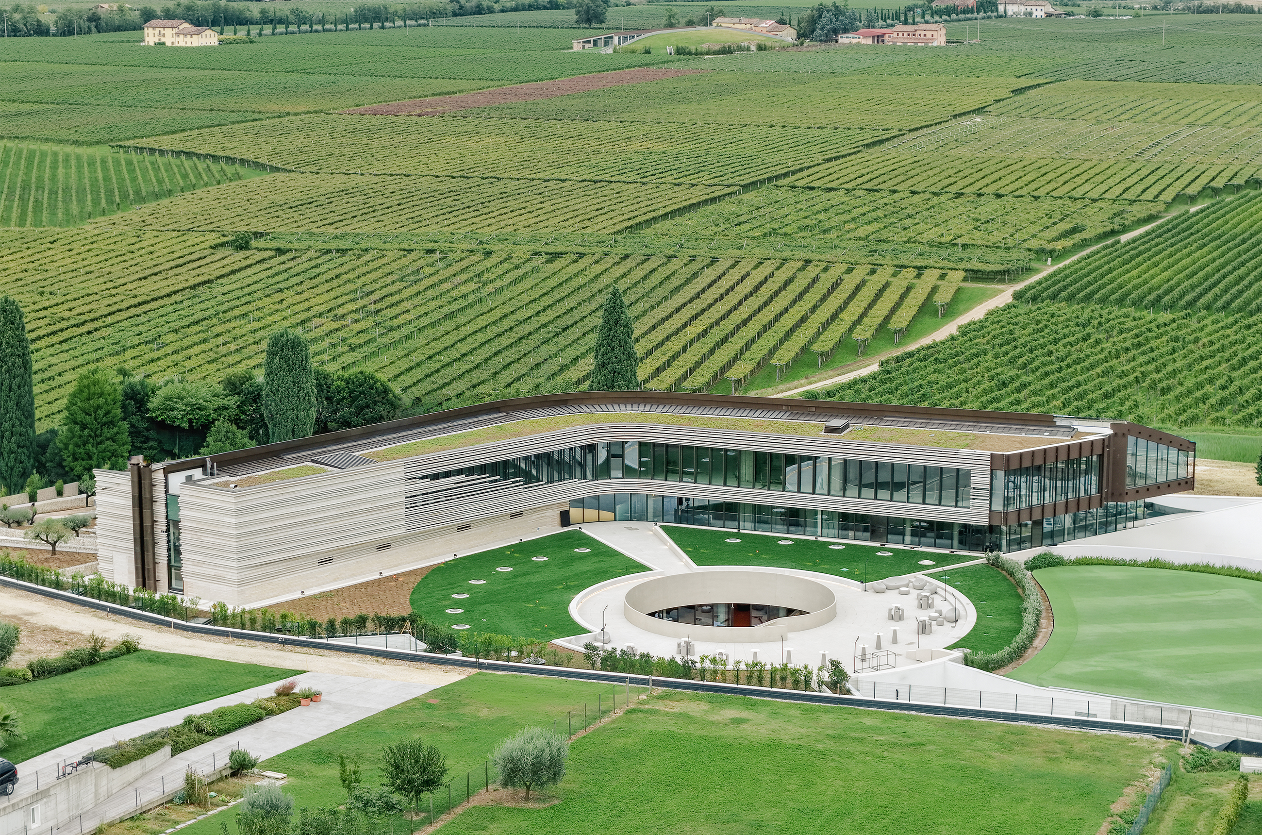The Masi winery, surrounded by green vines, from above