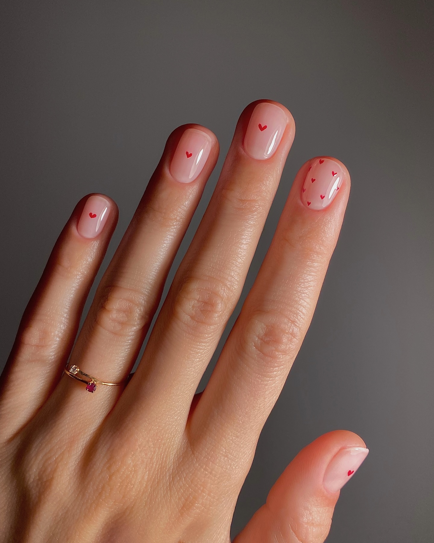 A manicure with tiny heart details by Mateja Novakovic