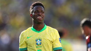 Brazil&#039;s Vinicius Junior smiles on the field during his team&#039;s game against Colombia at Copa America 2024.