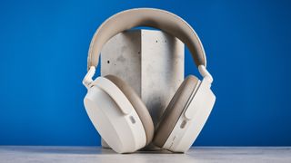 the sennheiser momentum 5 in white photographed against the blue tom's guide background