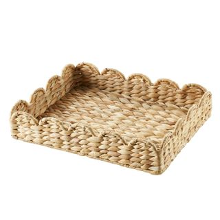 A scalloped-edge rattan tray