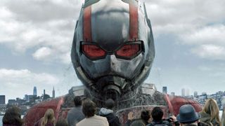 Ant-Man's giant form rises from a river as he looks over a ferry in Ant-Man and the Wasp