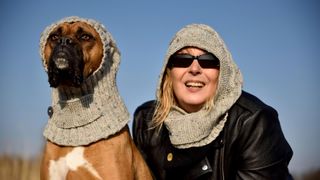 Woman and her boxer with same head scarf