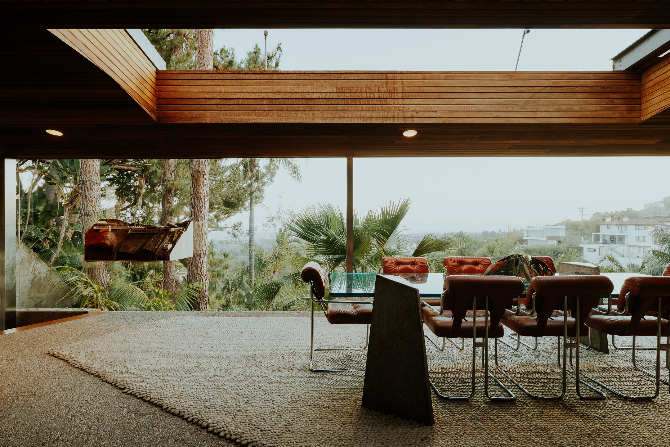 Sheats-Goldstein Residence in LA with its concrete sloped roof, pool and green open grounds