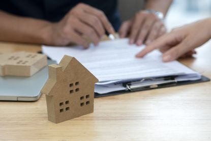 customer signing a real estate contract