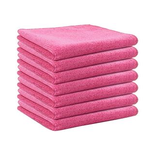 A stack of folded pink microfiber cloths