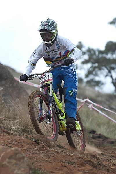 World junior champion Troy Brosnan from South Australia heads towards another victory in the men's under 19 downhill.