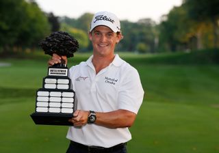 Bud Cauley poses with the Hotel Fitness Championship trophy