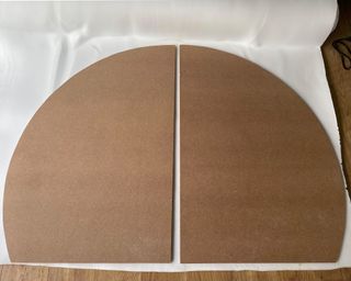 Two MDF semi-circles laid out on upholstery foam