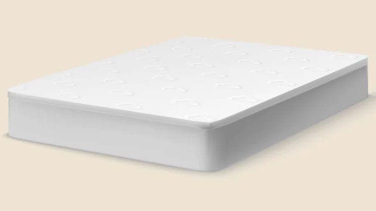 The Puffy Deluxe Mattress Topper on a light beige background