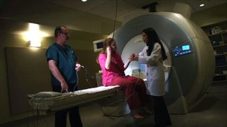 A participant prepares to listen to new music in a functional magnetic resonance imaging (fMRI) machine.