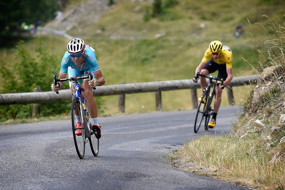 Chris Froome follows Vincenzo Nibali on the descent.