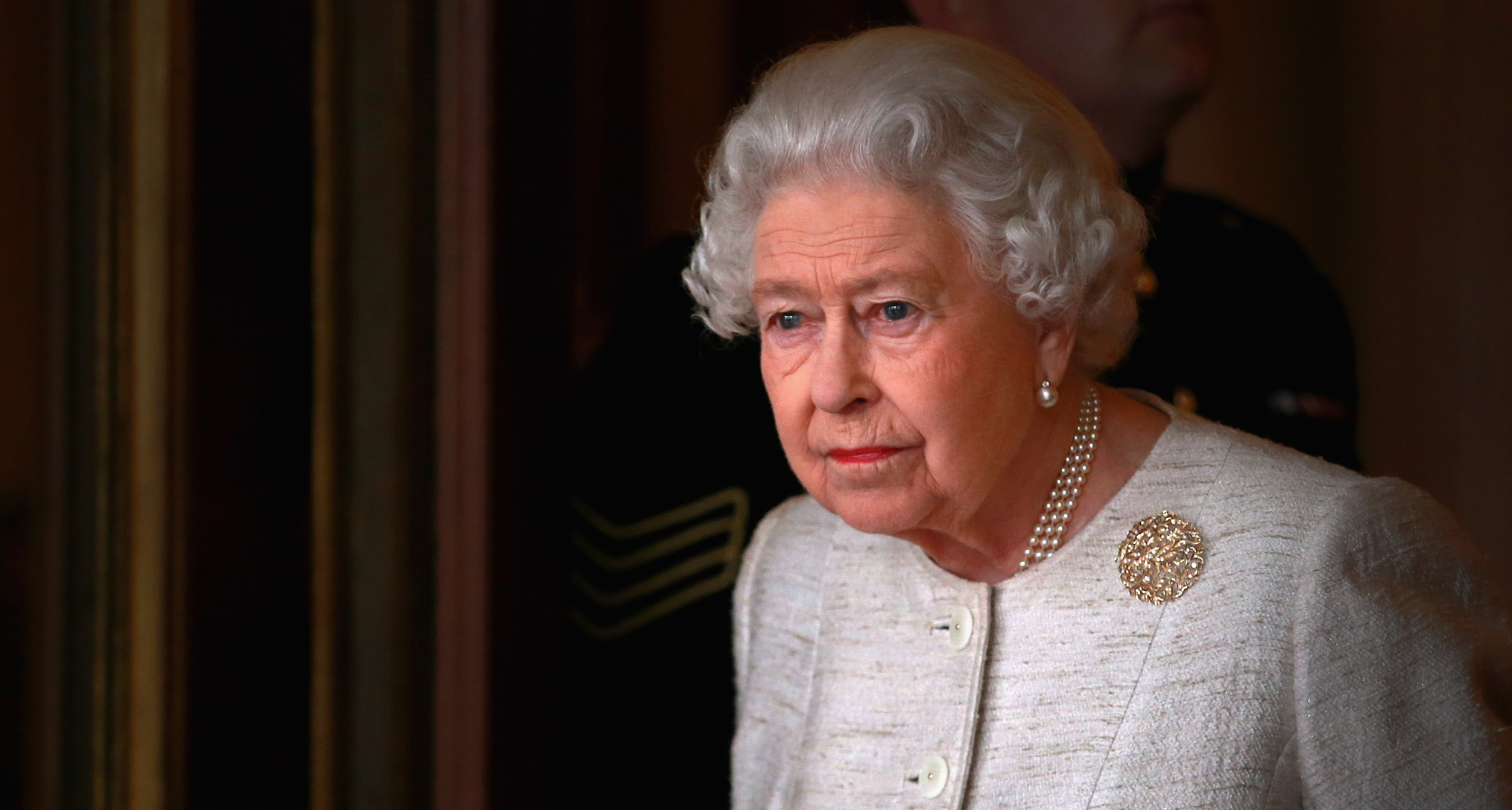 Queen Elizabeth looking out a window 