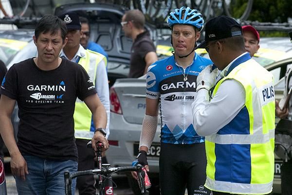 Former tour winner Tom Danielson (Garmin Barracuda) is led back to his team car after finishing more than eighteen minutes behind winner Jose Serpa.