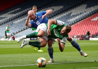 Hibernian’s Ryan Porteous collides with St Johnstone’s Christopher Kane during the Scottish Cup final