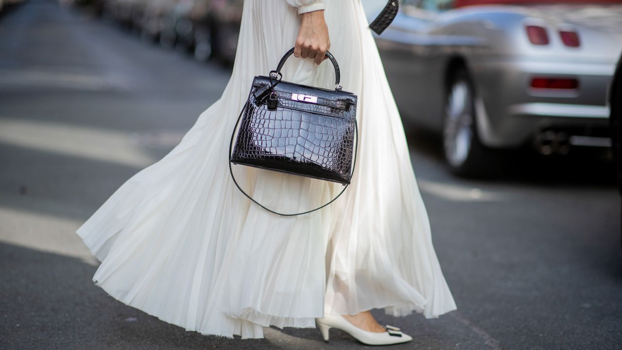 woman in maxi skirt and white heels