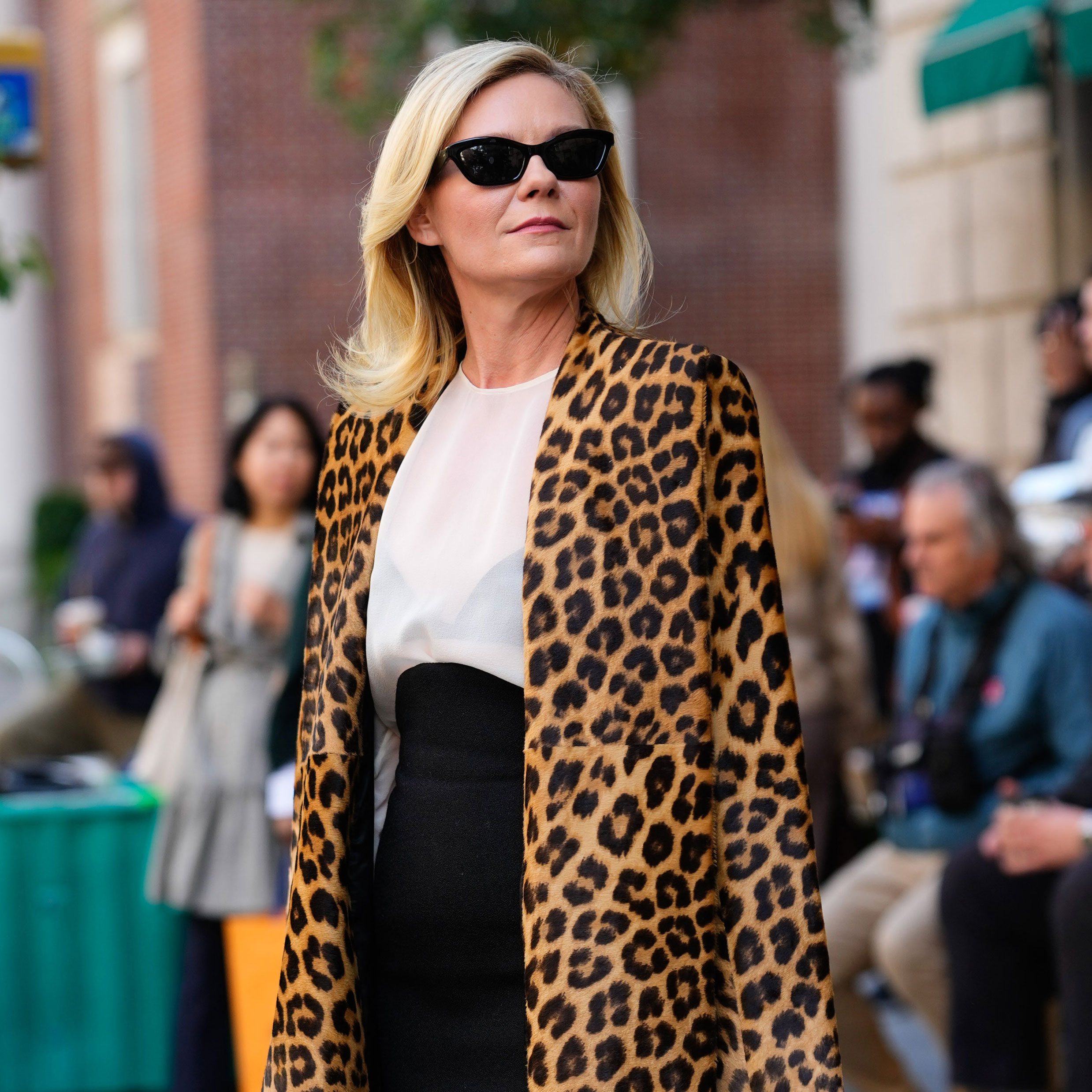 Kirsten Dunst on the set of The Housemaid's Secret wearing a leopard coat