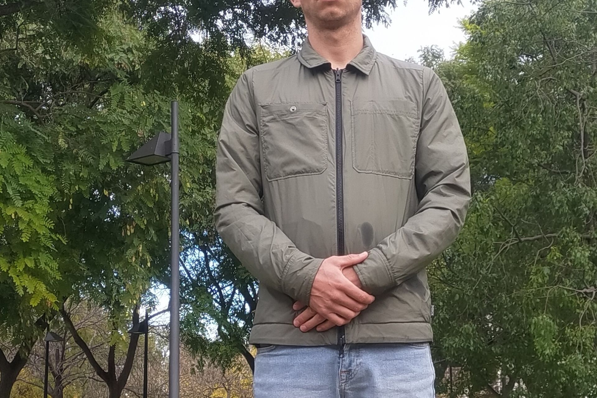 Image shows a rider wearing the Chrome Two Way Insulated Shacket