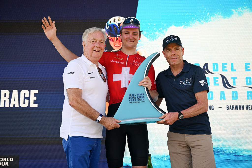 GEELONG AUSTRALIA FEBRUARY 02 LR Businessman Gerry Ryan the race winner Mauro Schmid of Switzerland and Team Jayco AlUla and the exprofessional cyclist Cadel Evans pose at podium during the 9th Cadel Evans Great Ocean Road Race 2025 Mens Elite a 1838km one day race from Geelong to Geelong UCIWT on February 02 2025 in Geelong Australia Photo by Dario BelingheriGetty Images