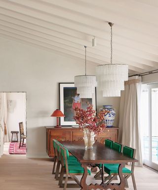 dining room with table and chairs and two pendant lights