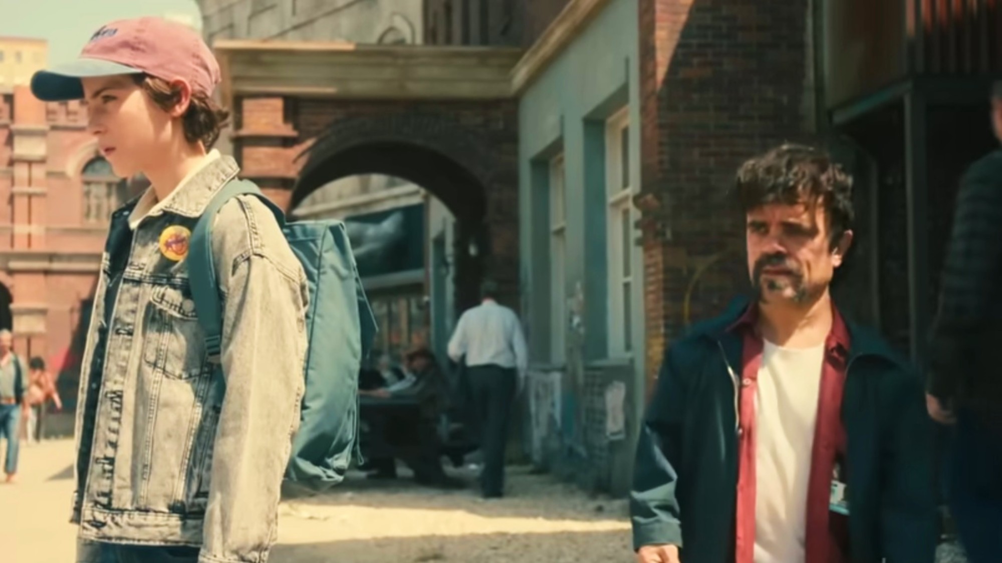 Peter Dinklage having a thoughtful conversation with Jacob Tremblay in The Toxic Avenger