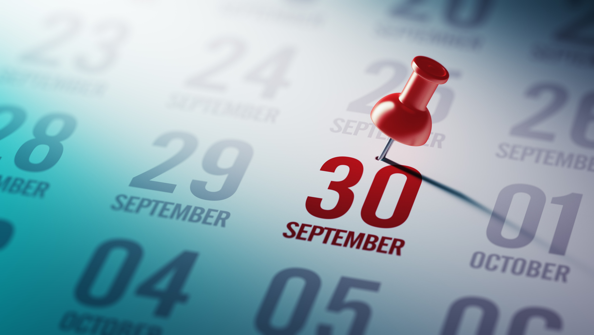 calendar with a red push pin on the September 30 date