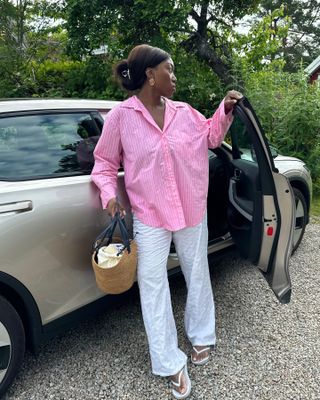 Nnenna Echem in a pink striped button down shirt