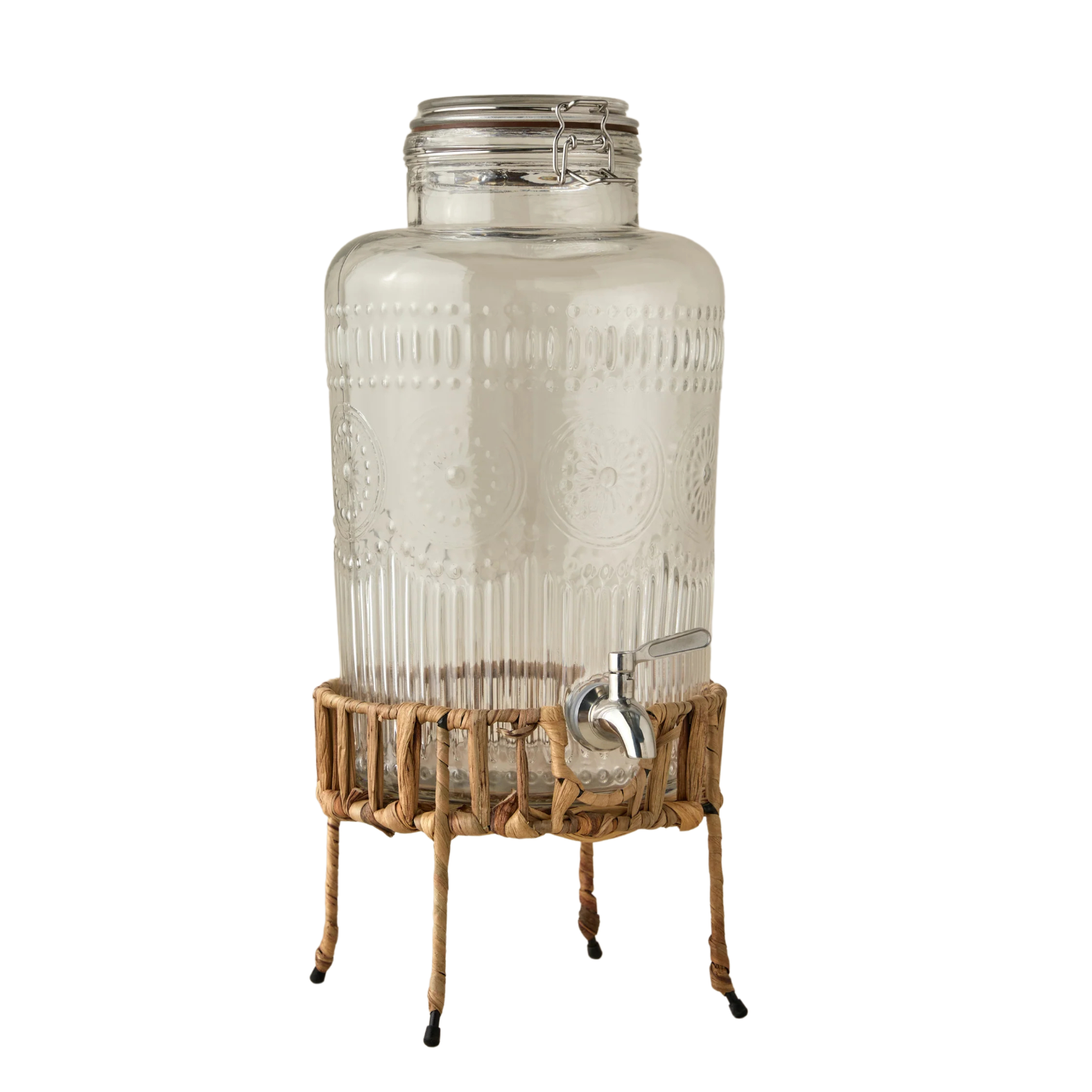 glass drinks dispenser on rattan stand